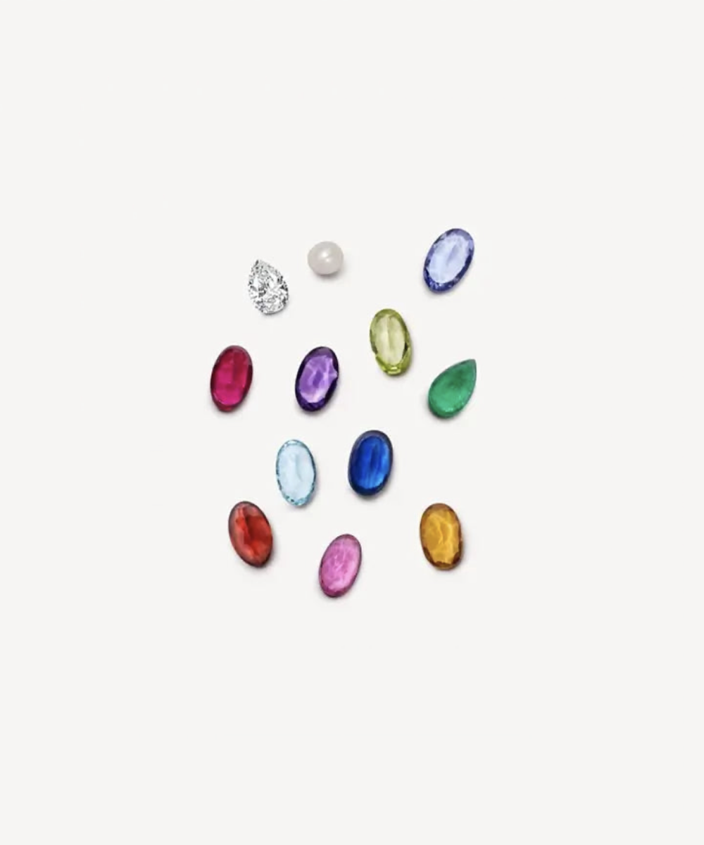 A scatter of colourful birthstones locket charms