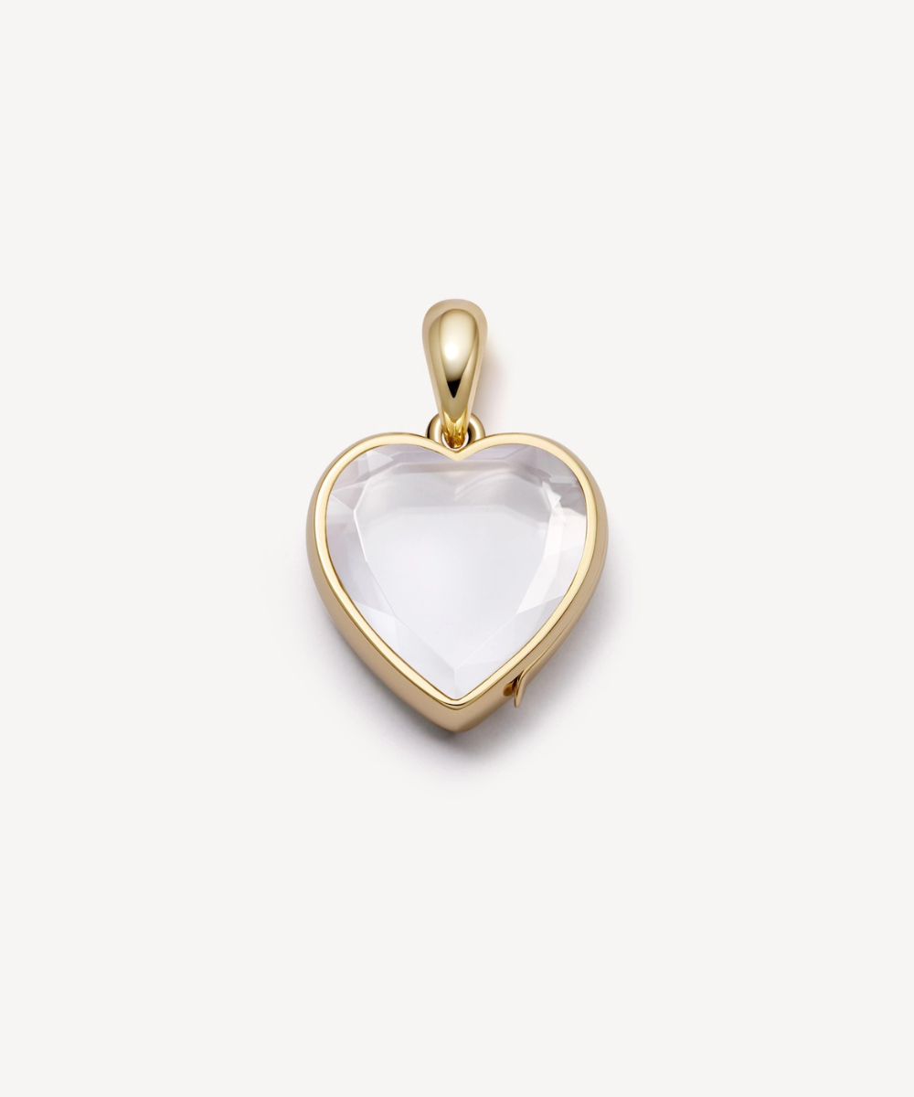 Yellow gold mini yellow gold heart shape locket with faceted crystal facade.