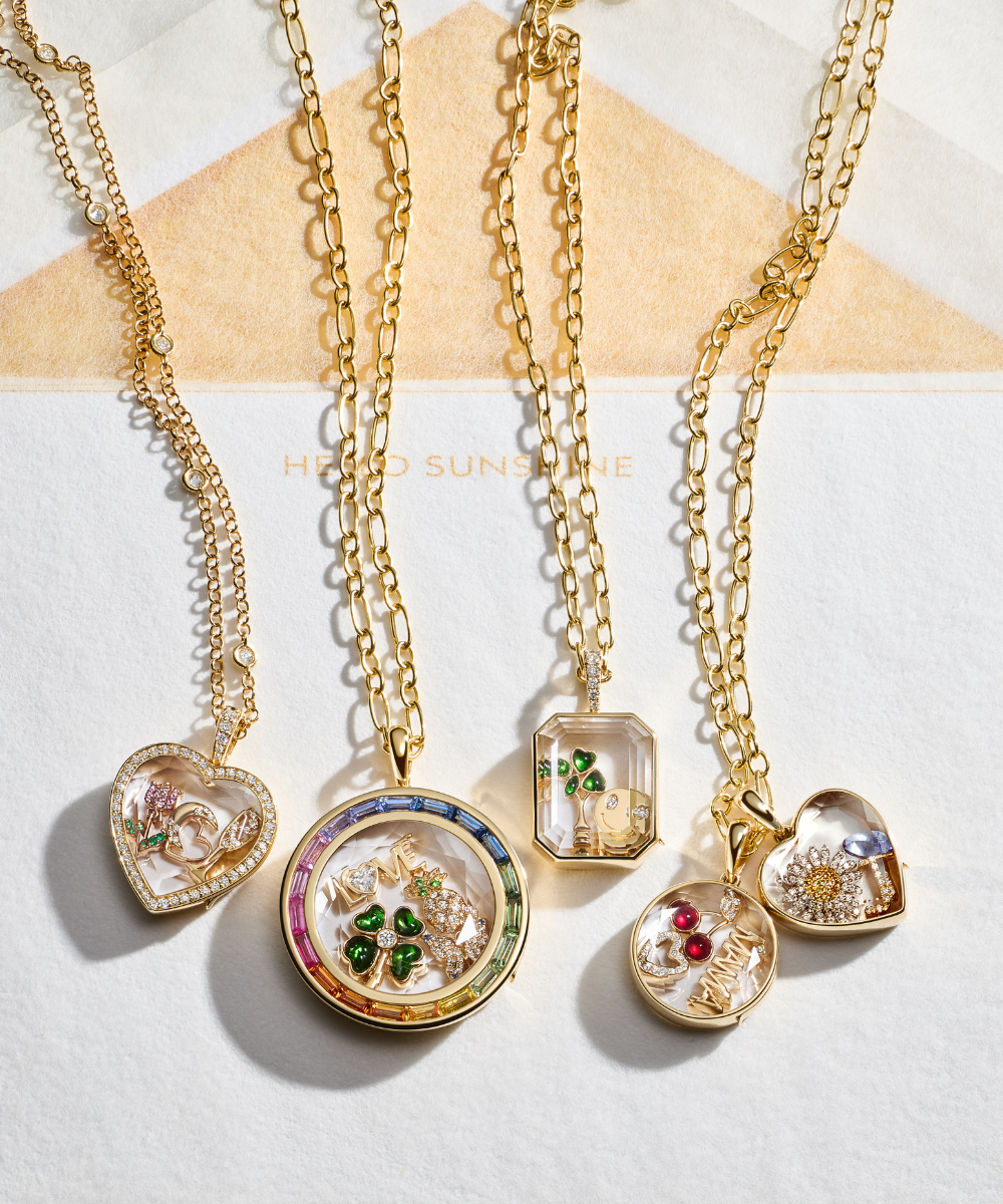 Diamond rim round locket pendant in yellow gold and diamond bail with faceted crystal facade.