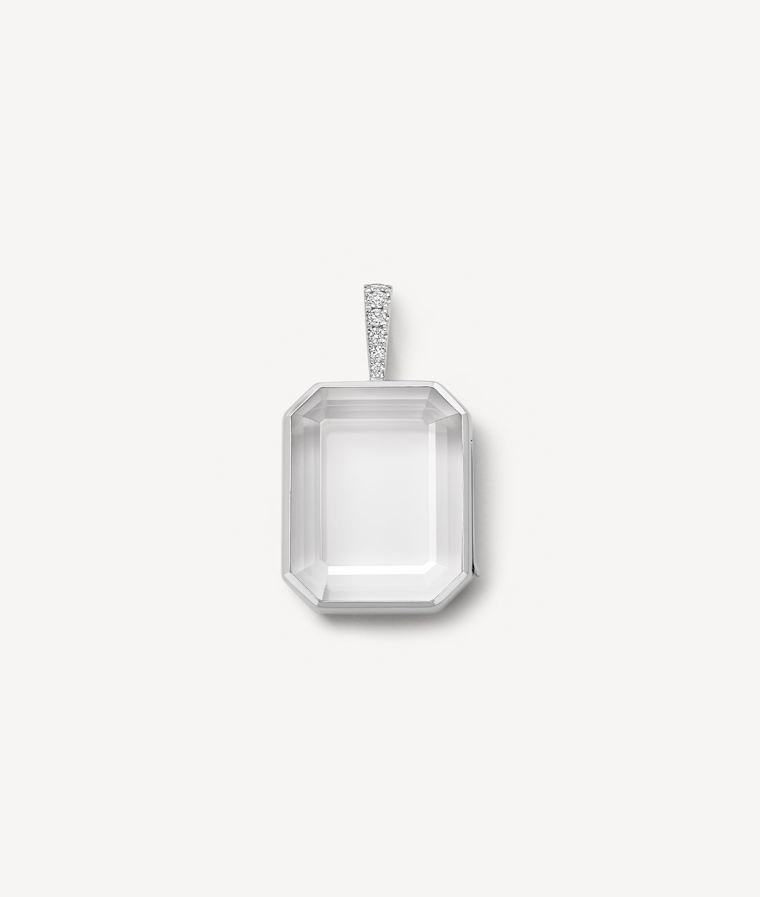 white gold baguette locket pendant with diamond bail and clear crystal on a white background