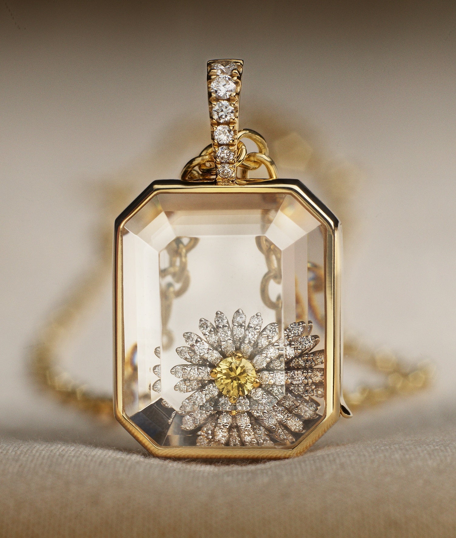 Baguette locket diamond standing styled with a daisy diamond charm