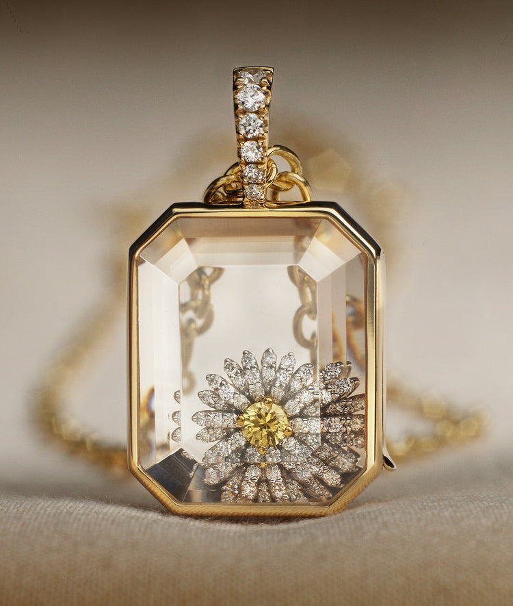 Baguette locket diamond standing styled with a daisy diamond charm
