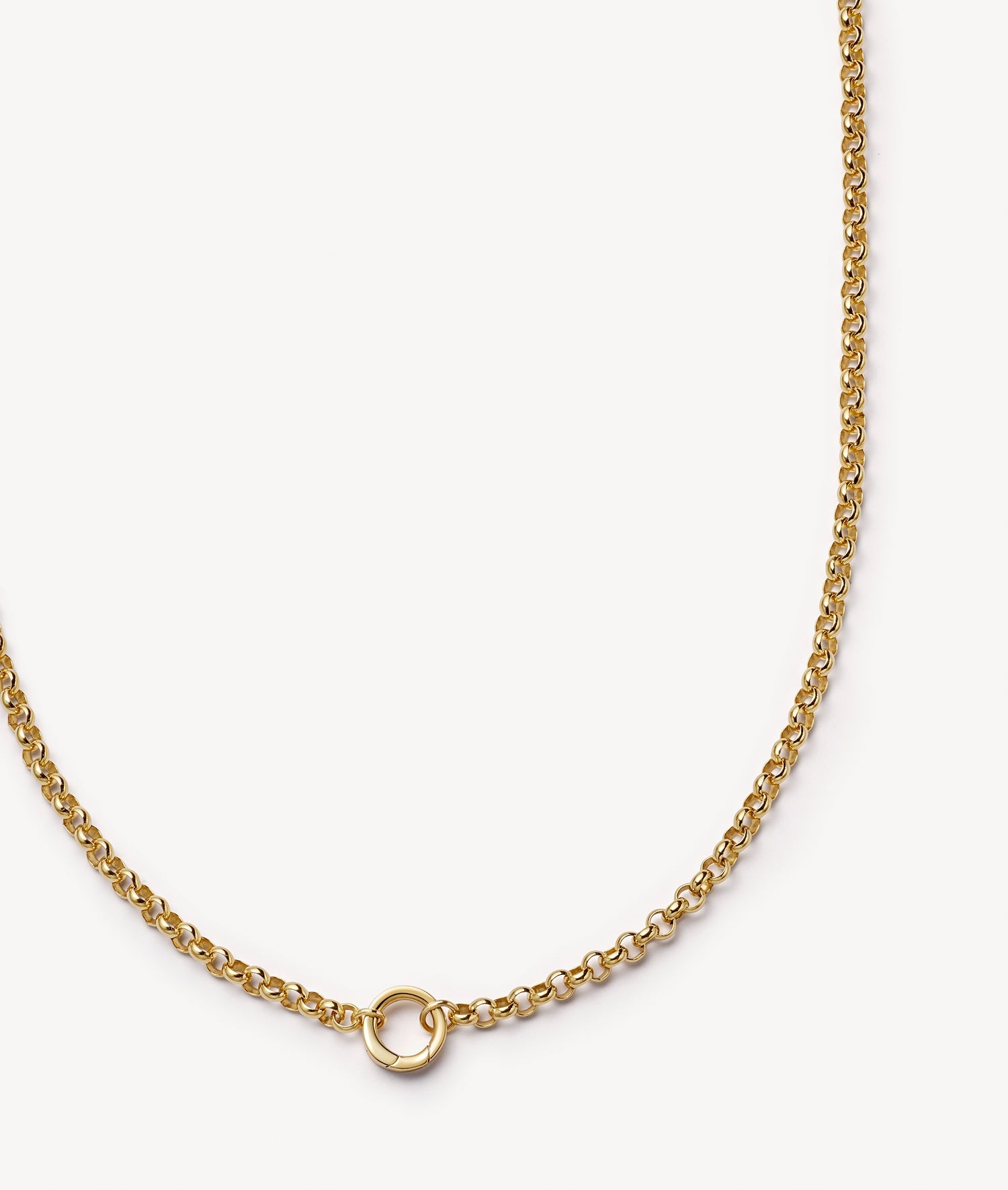 A delicate gold belcher chain necklace with a small hoop, displayed on a clean, light off-white background.