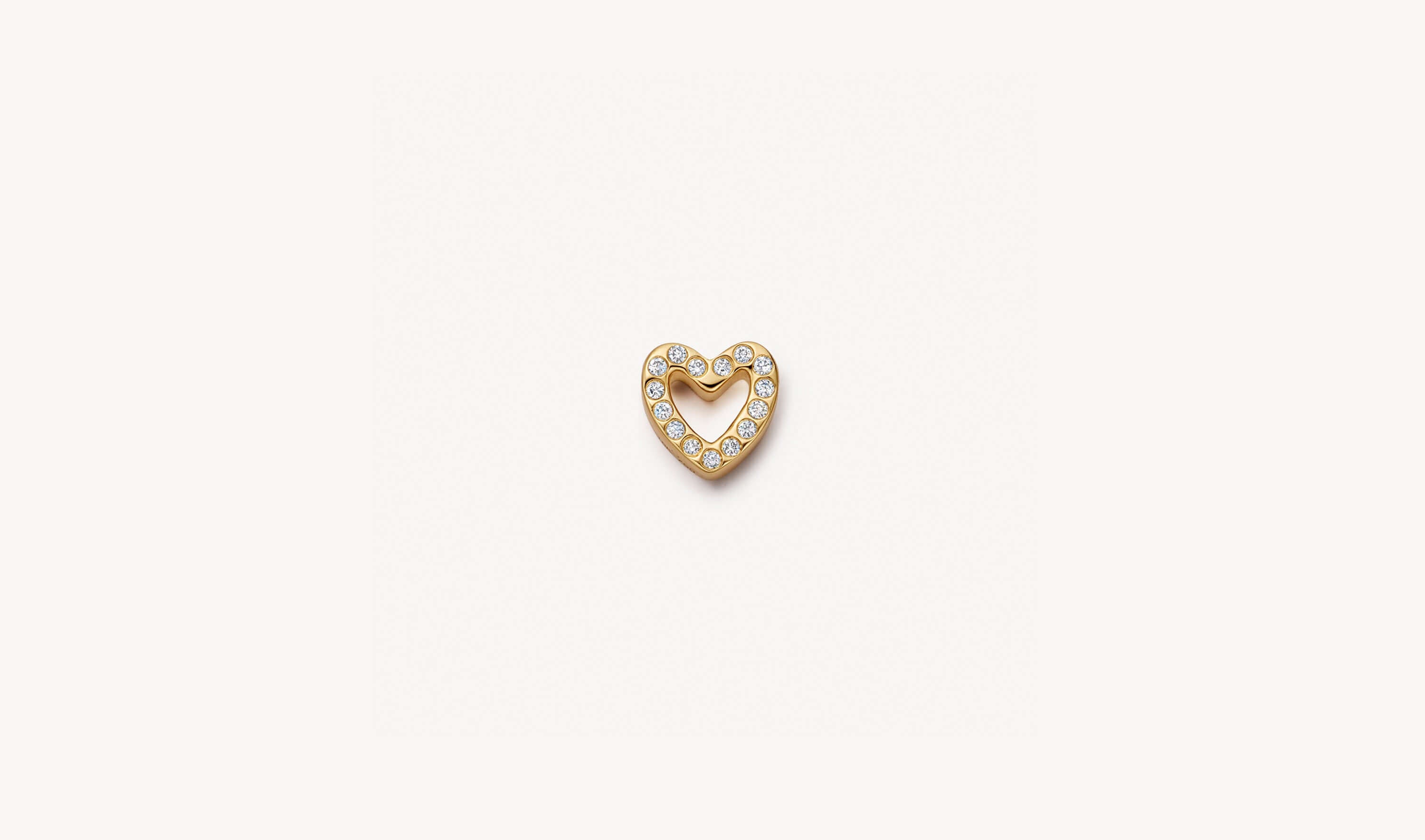 Yellow gold heart shaped charm set with white diamonds