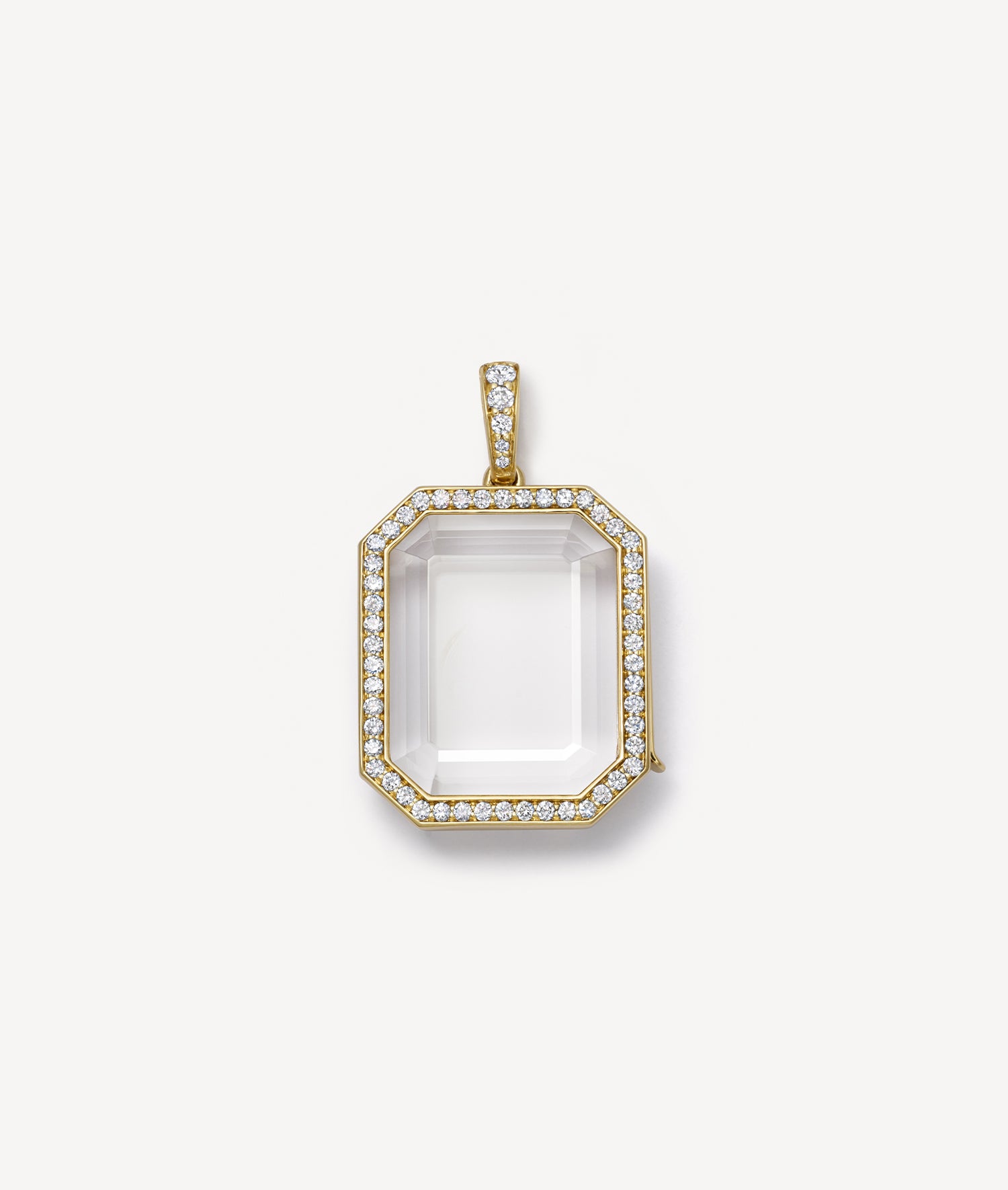 yellow gold diamond baguette locket pendant on a white background
