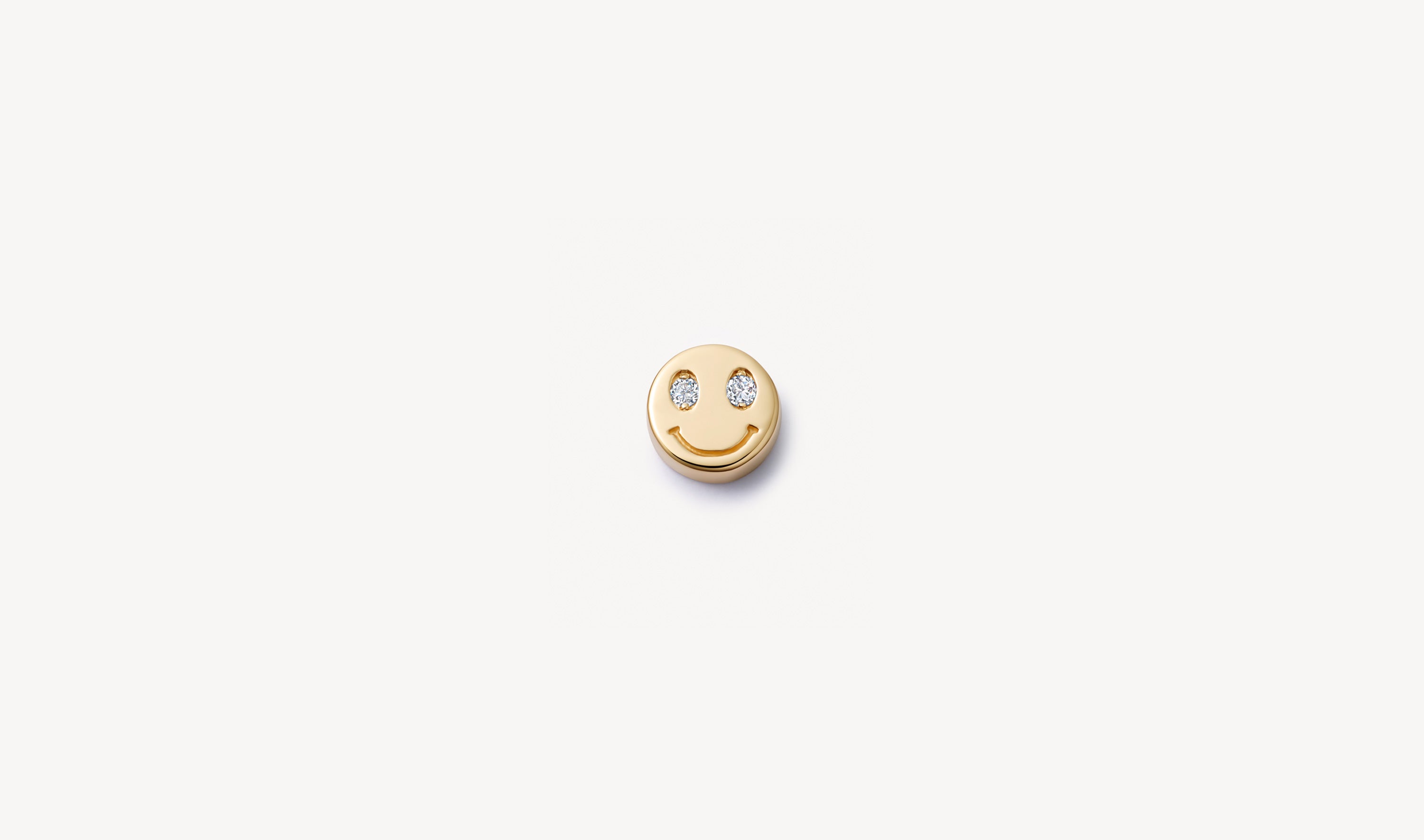locket smiley charm crafted in yellow gold with diamond eyes