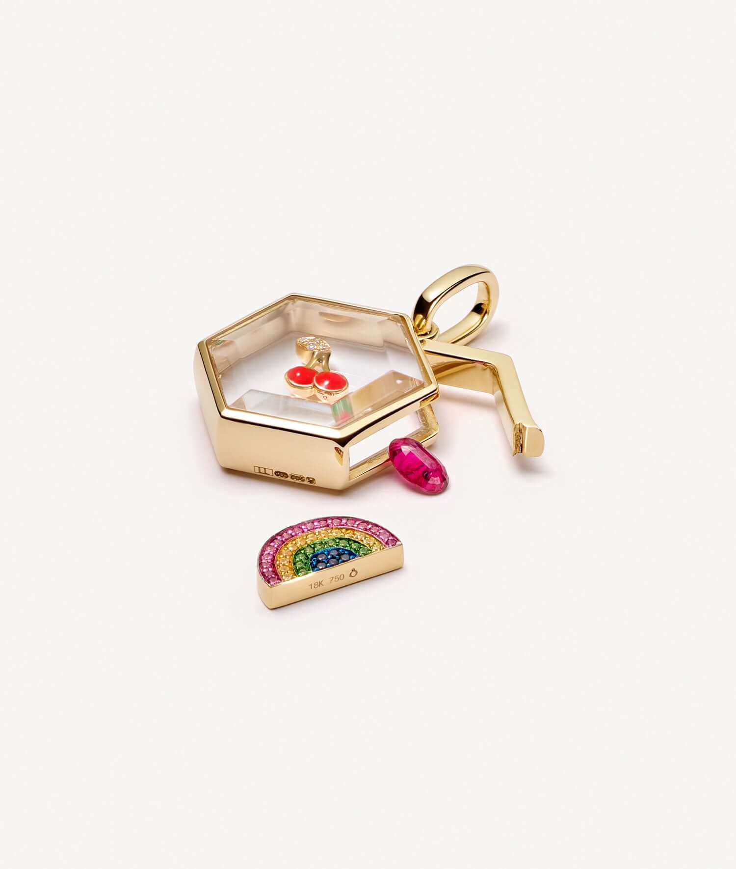 Yellow gold honeycomb locket styled open with charms.