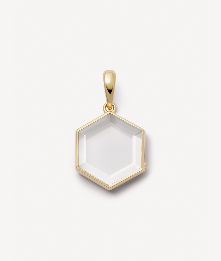 Yellow gold honeycomb locket styled empty.