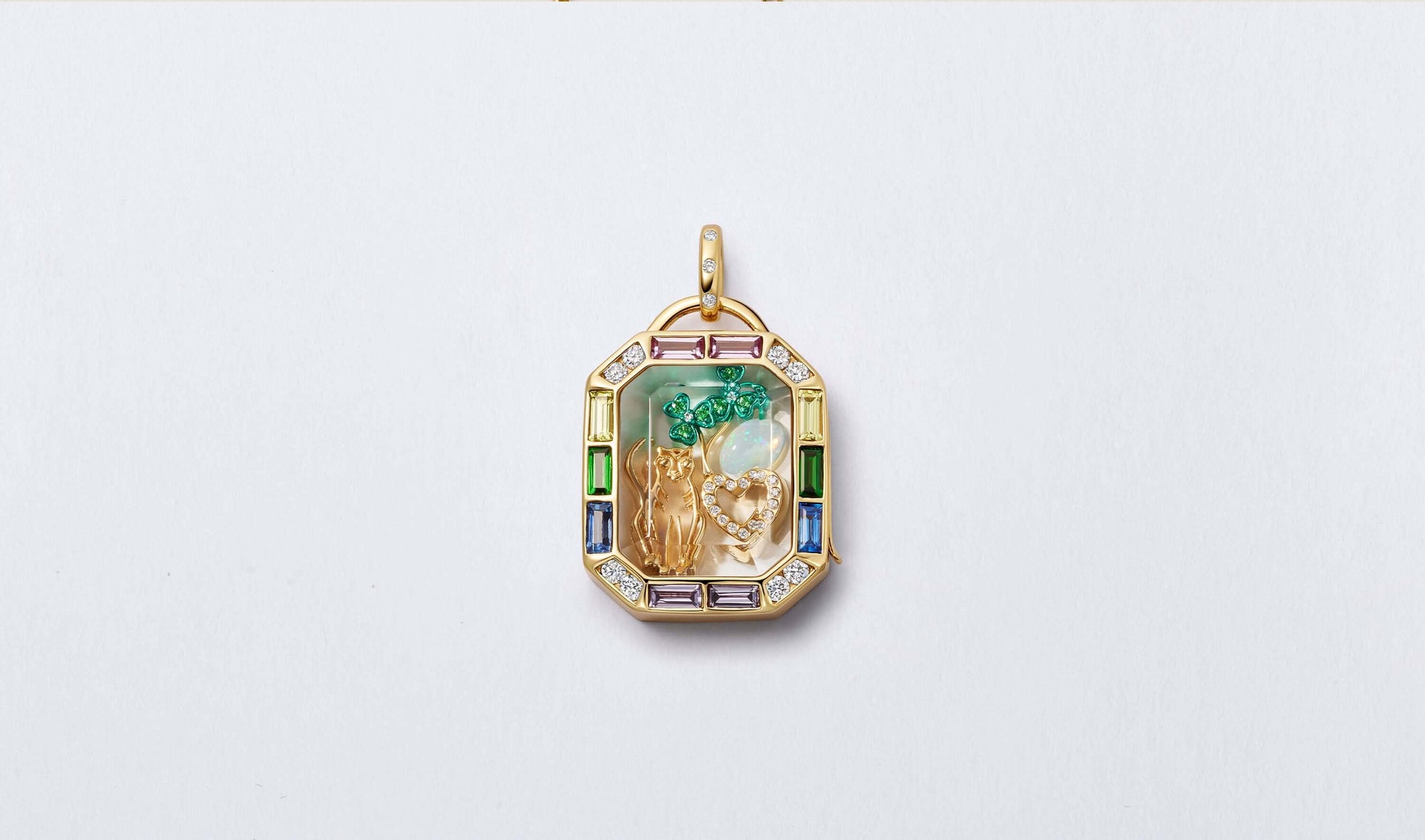 Iris rainbow locket styled with charms.