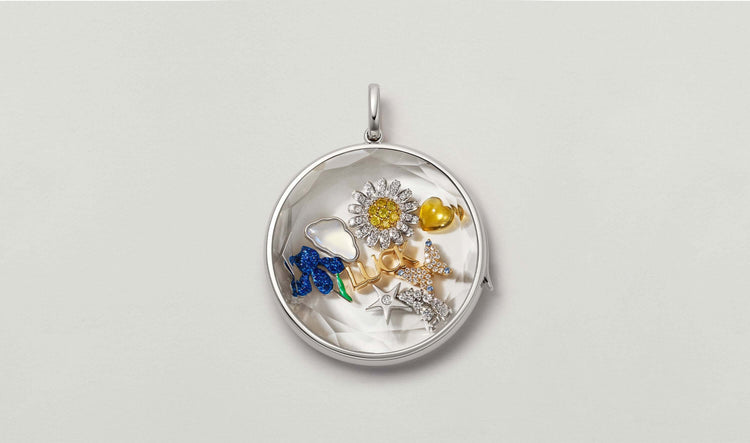 Jupiter white gold locket with charms,