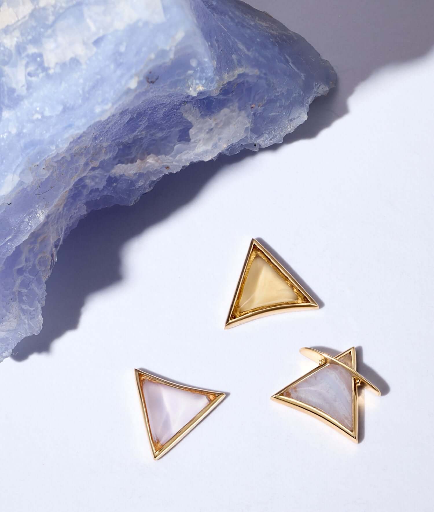Kate Kane charms next to a heeling crystal.