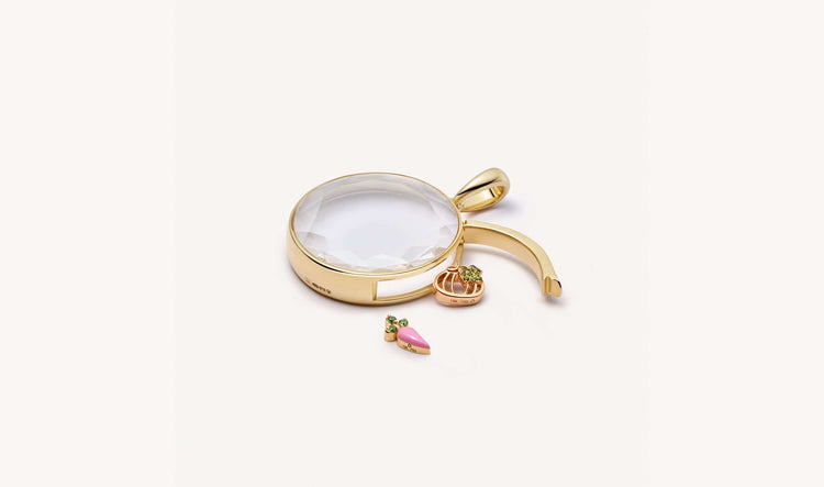 Locket pendant open latch with pumpkin charm on the outside