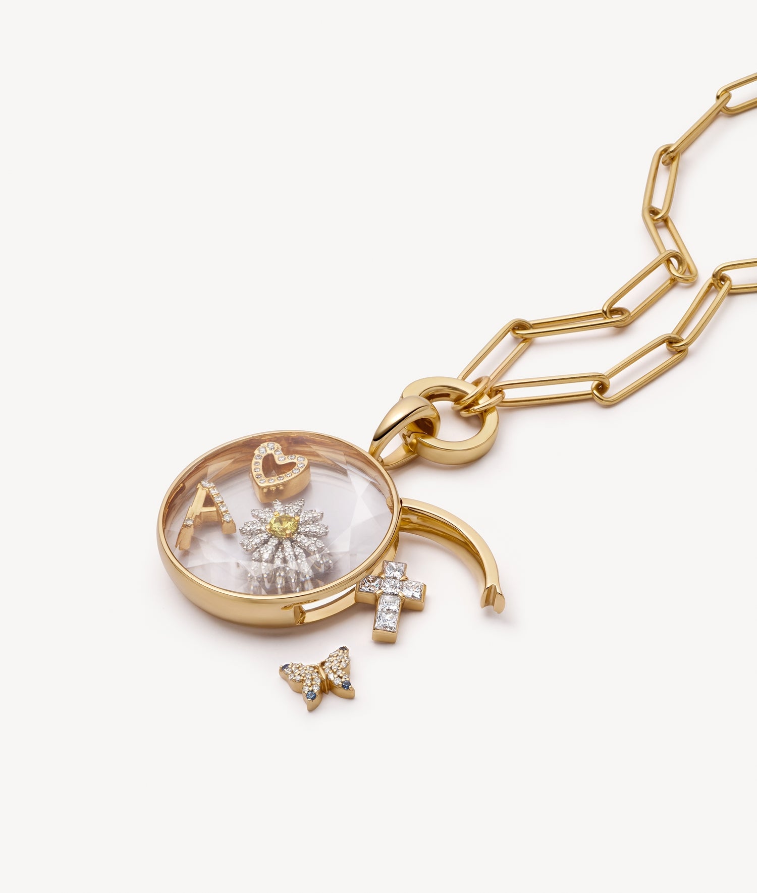 Open round locket pendant in yellow gold with diamond charms