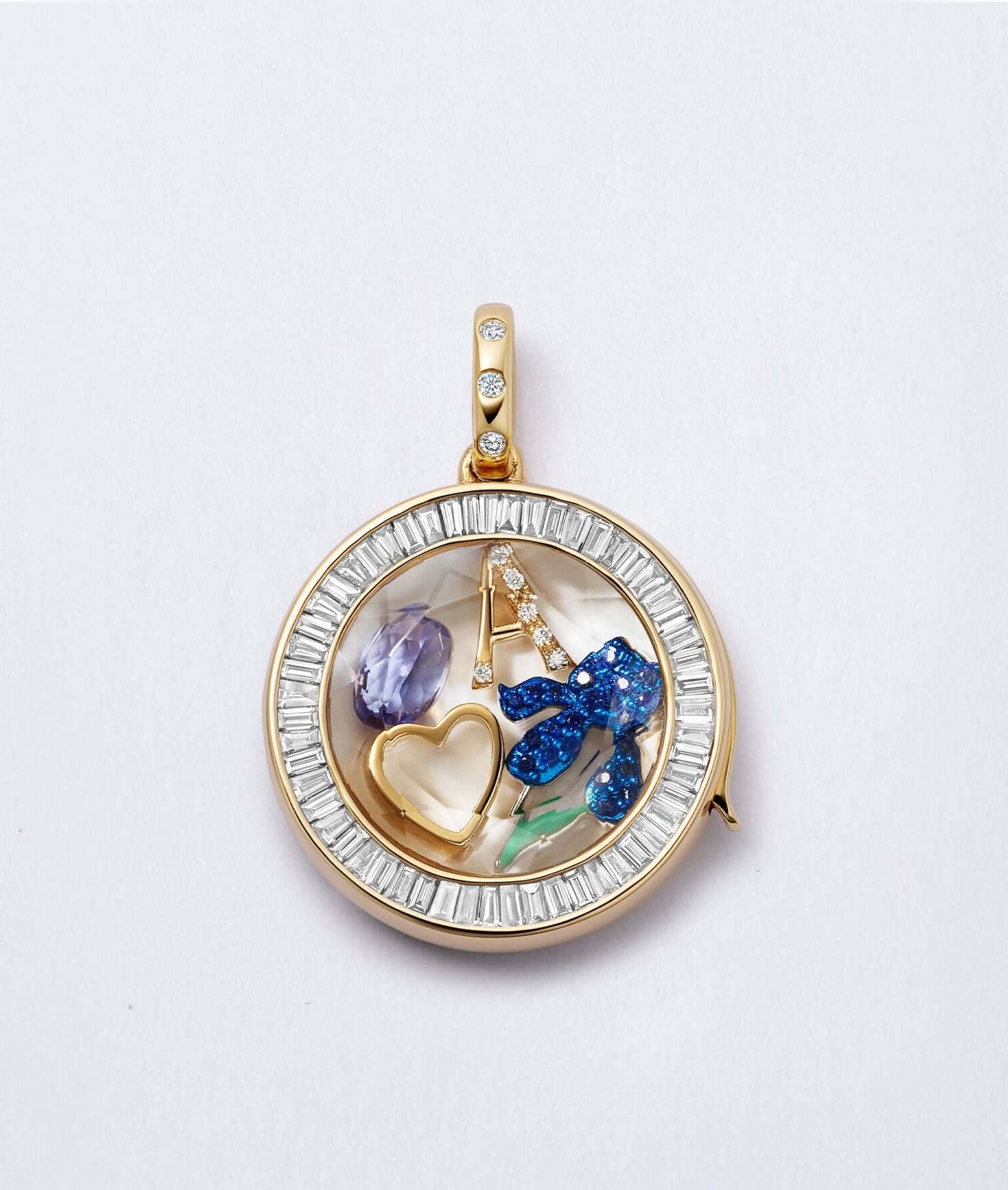 Orb diamond baguette locket styled with charms: iris, heart, amethyst, letter A.