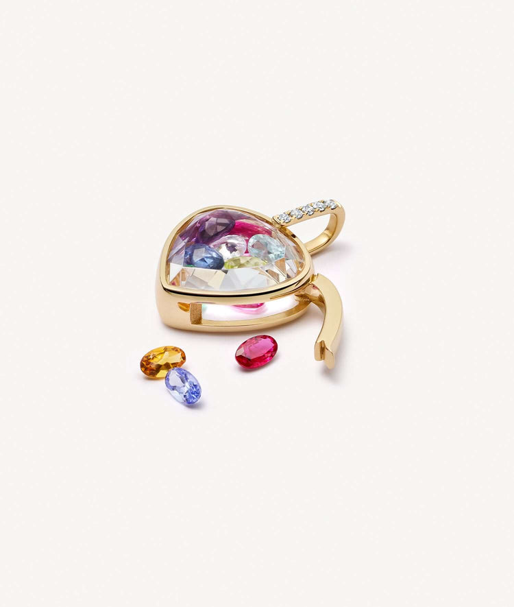 Pear cut gold locket styled with the latch open, with various birthstones. 