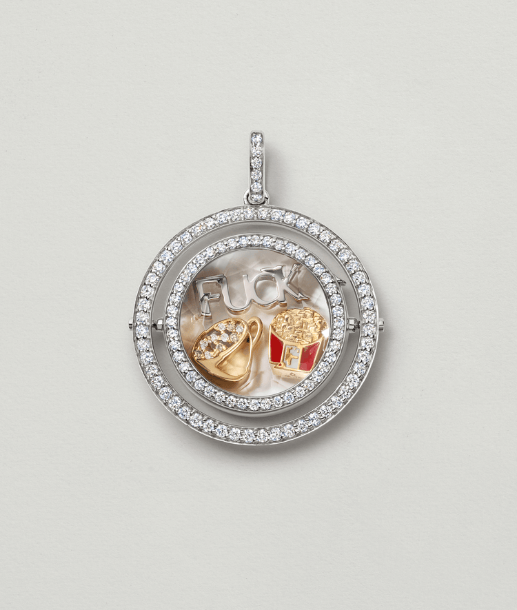 Saturn diamond locket in white gold personalised with a coffee cup charm and other charms of our collection