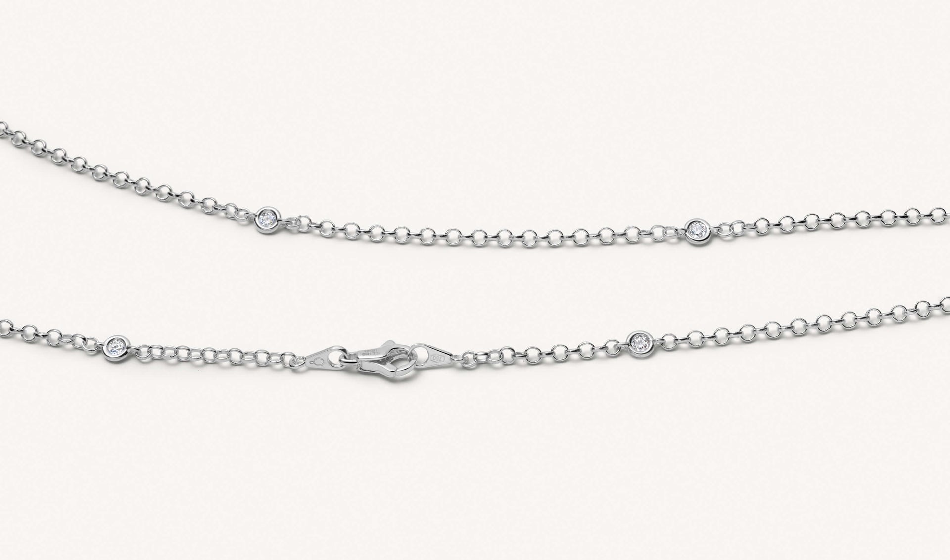 Close up shot of the white gold diamond necklace, short chain.