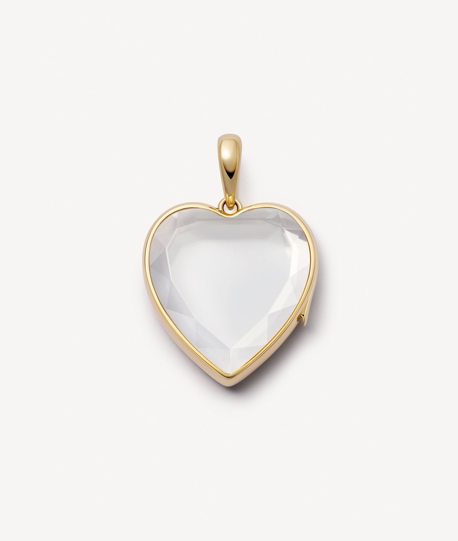Yellow gold large heart charm locket pendant with a faceted crystal facade on a white background.