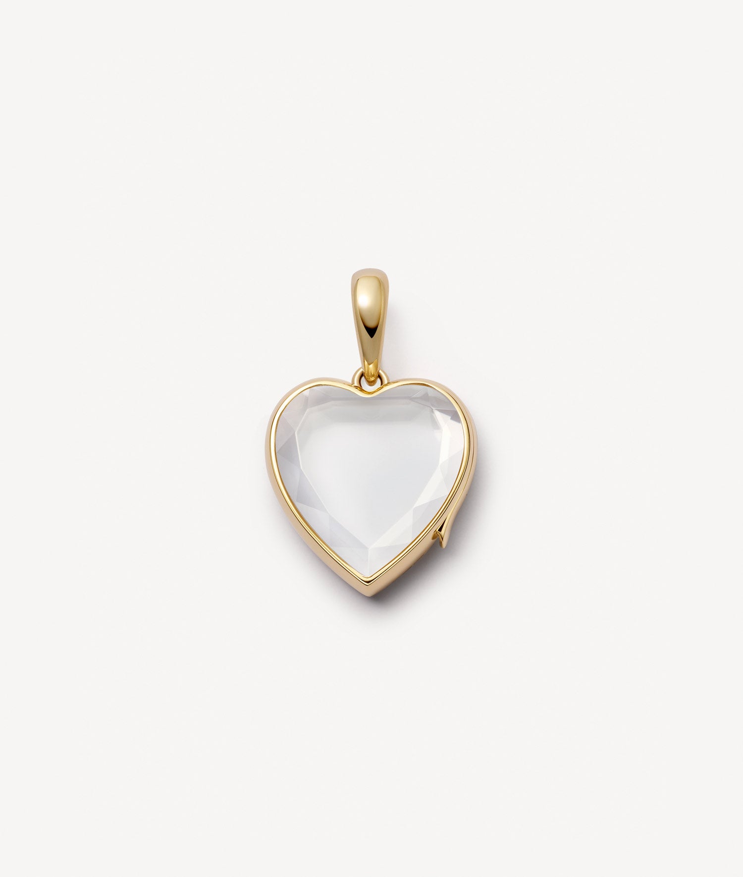 Yellow gold medium heart charm locket pendant with a faceted crystal facade on a white background.